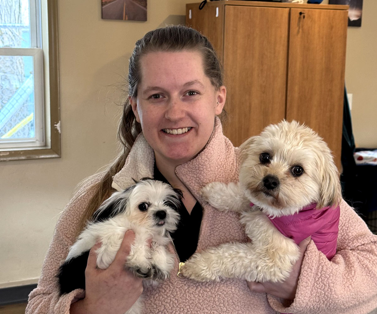 aboutus-dayhollowanimalhospital veterinary team member holding two small dogs