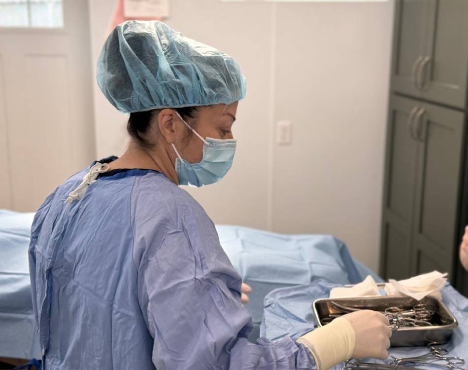 Surgeon prepares tools in the operating room Surgeon prepares tools in the operating room